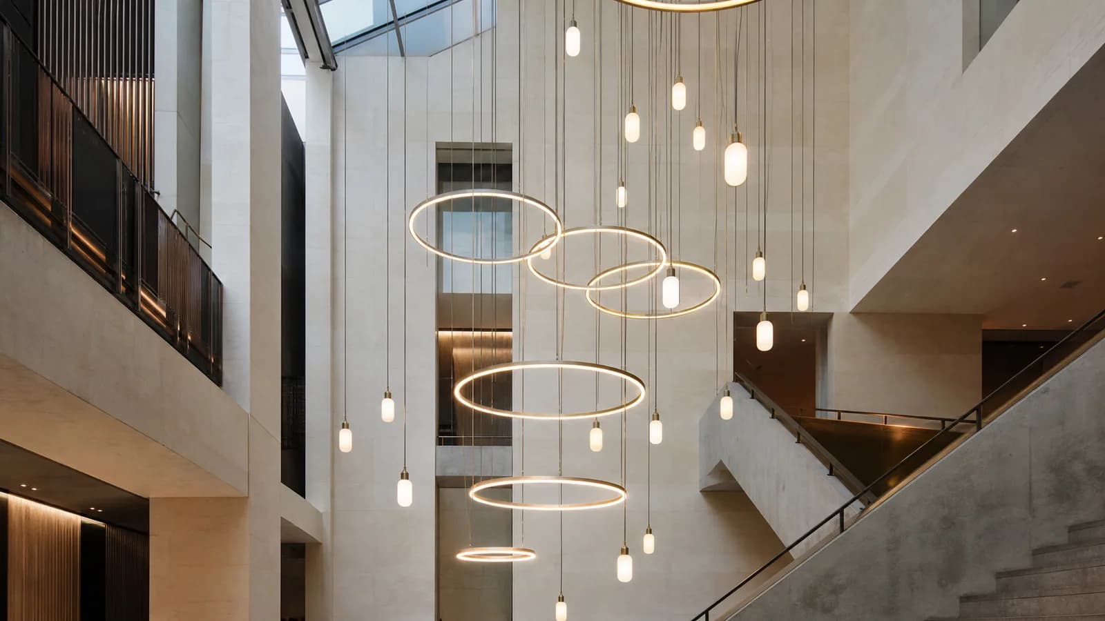 Cultural Atrium. Multi-level suspended composition · Rings and opal glass · 3000K